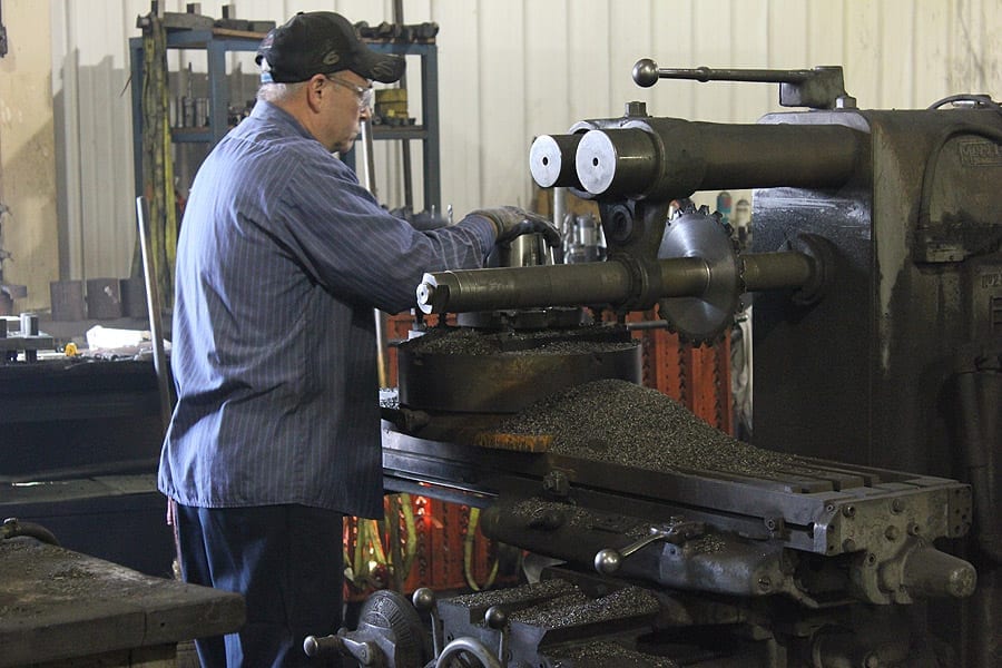 A fabricator at Swanton Welding demonstrating CNC Machining