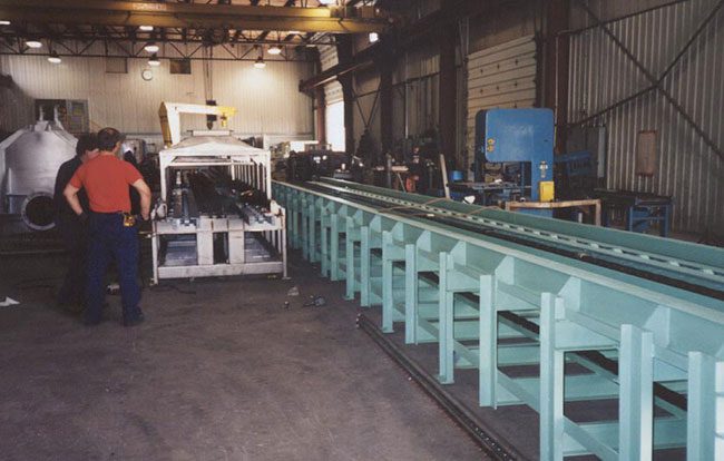 Conveyor line for steel fabrication.