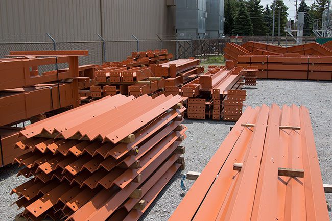 structural steel fabricator Swanton Welding created Steel Beams Piled for Transports