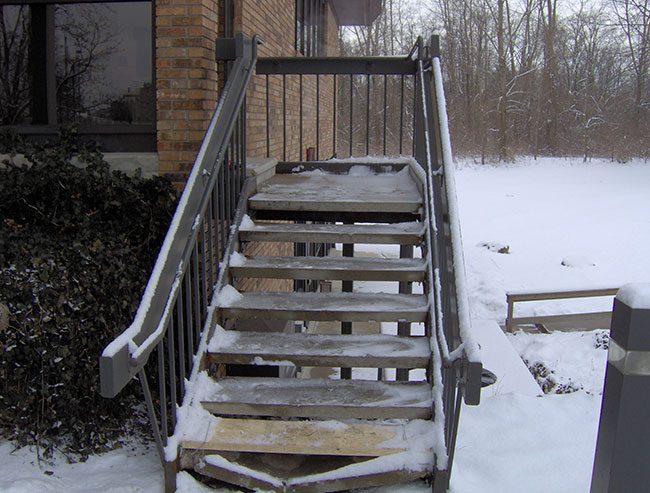 These wooden exterior stairs are in need of replacement and an ice hazard