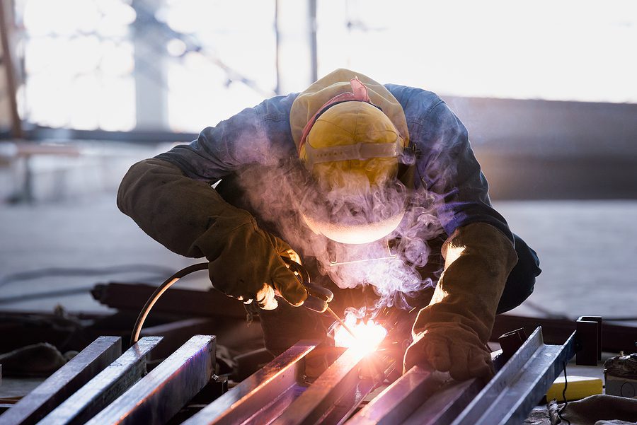 Certified welder working on a custom fabrication project.