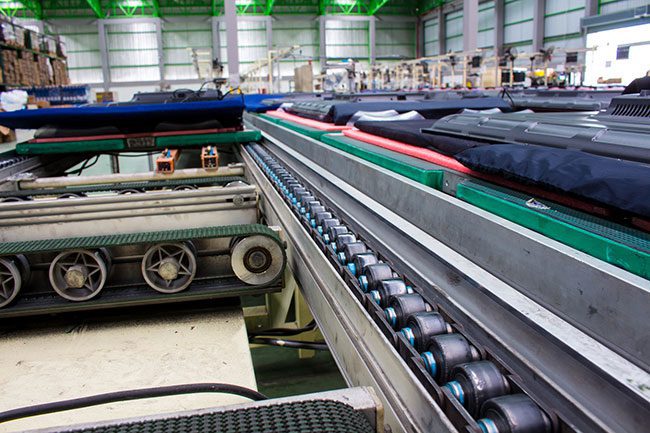 multiple conveyor belts forming an assembly line for parts