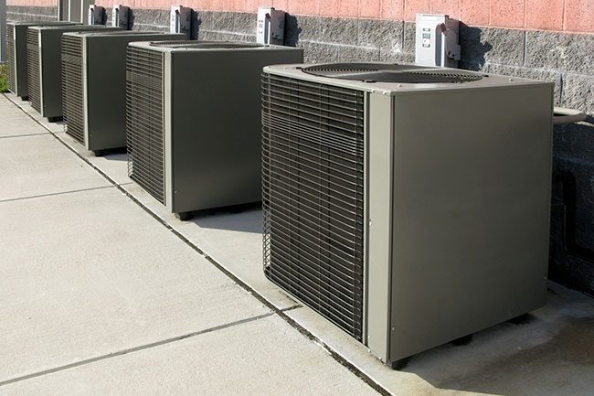 HVAC Units on building exterior connect to ductwork