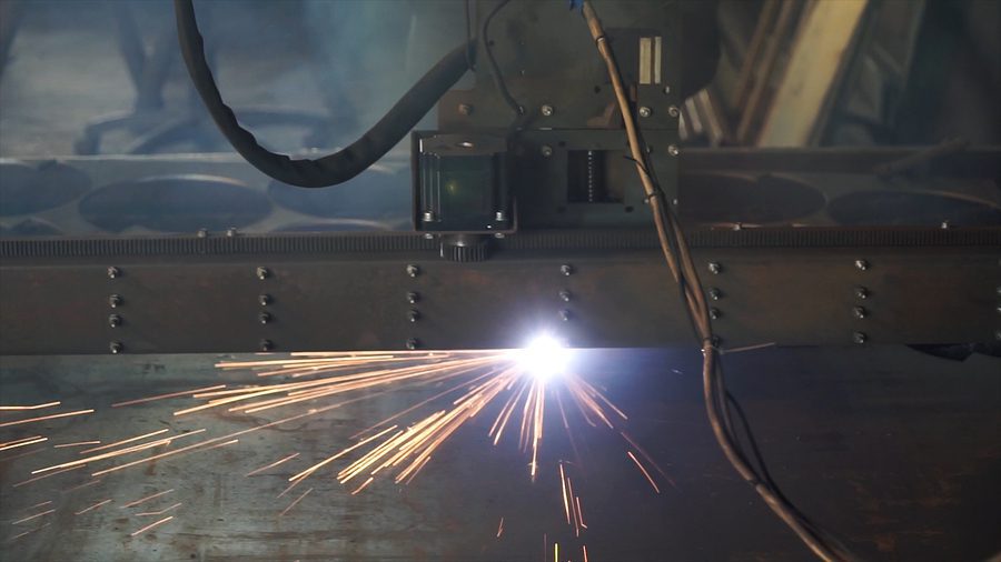 Metal fabrication with sparks flying.