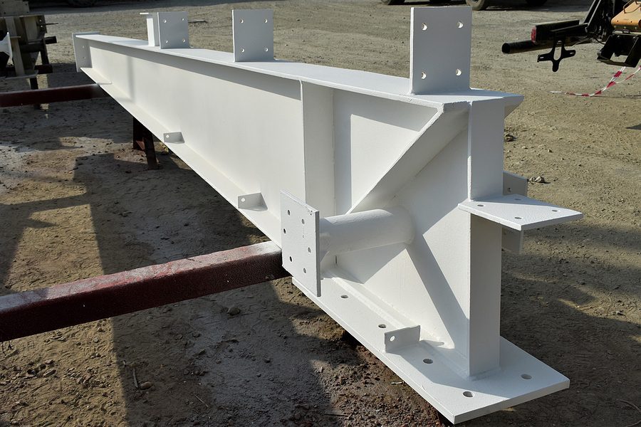 Powdered-coated structural steel beam ready for commercial construction project.