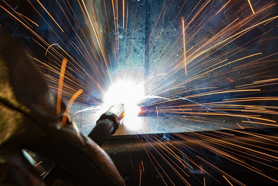 Abstract view of welder working on a metal project.