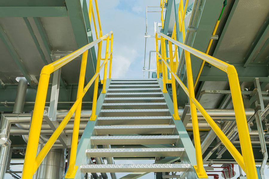 exterior steel staircase at industrial site.
