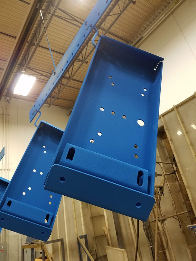 Parts in powder coating line.