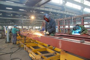 Welders working on a large steel project. 