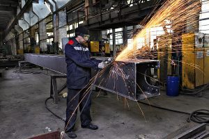 Welder working on a large steel beam. 