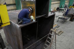 Swanton Welding shop floor with skilled welding working on a custom project.